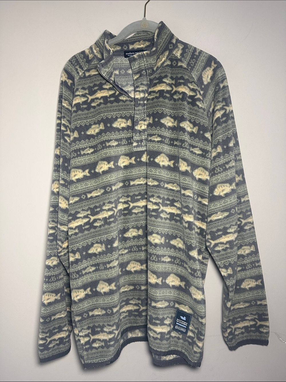 Southern Marsh Angler fleece pullover featuring an all-over fish pattern